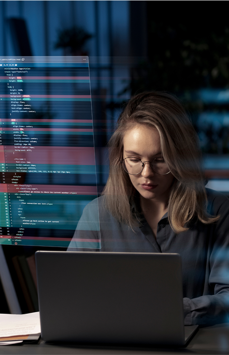woman sat at laptop with server